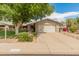 Charming single-story home with a manicured front lawn and inviting curb appeal at 12714 W Copperstone Dr, Sun City West, AZ 85375