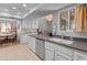 Bright kitchen with white cabinets, stainless steel dishwasher and eat-in kitchen at 12714 W Copperstone Dr, Sun City West, AZ 85375
