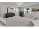 Bright main bedroom with a dresser, window, and neutral carpet at 12714 W Copperstone Dr, Sun City West, AZ 85375