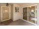 Enclosed patio with decorative door and sliding glass doors leading to the interior at 12714 W Copperstone Dr, Sun City West, AZ 85375