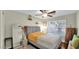 Cozy bedroom featuring hardwood floors, ceiling fan, and natural lighting at 139 W Granada Rd, Phoenix, AZ 85003
