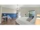 Large bedroom featuring a ceiling fan, ensuite access, a desk, and a private exterior entry at 139 W Granada Rd, Phoenix, AZ 85003