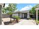 Charming exterior view of home showcasing the garage, front door, and landscaped yard at 139 W Granada Rd, Phoenix, AZ 85003