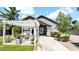 Stylish home with a modern pergola, outdoor seating, and a well-manicured yard at 139 W Granada Rd, Phoenix, AZ 85003