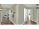 Bright hallway with hardwood floors, recessed lighting and views of the adjacent living area at 139 W Granada Rd, Phoenix, AZ 85003