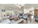 Open-concept living room featuring a fireplace, hardwood floors, and ample natural light at 139 W Granada Rd, Phoenix, AZ 85003