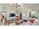 Cozy living room featuring hardwood floors, large windows, and comfortable seating at 139 W Granada Rd, Phoenix, AZ 85003