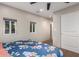 Bedroom with carpet, large windows, and a standard closet at 14749 E Pecos Rd, Gilbert, AZ 85295