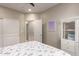 This bedroom features white sliding closet doors, carpet, and ceiling fan at 14749 E Pecos Rd, Gilbert, AZ 85295