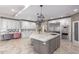 Large kitchen features custom cabinets, stainless appliances, beautiful backsplash, and a large marble island at 14749 E Pecos Rd, Gilbert, AZ 85295