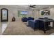 Elegant living room with plush seating, large windows, and stylish decor at 14749 E Pecos Rd, Gilbert, AZ 85295