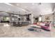 Inviting kitchen and living area, featuring a large island and seamlessly integrating with a cozy seating area at 14749 E Pecos Rd, Gilbert, AZ 85295