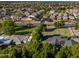 An aerial shot displaying the expansive neighborhood of well-maintained homes at 14749 E Pecos Rd, Gilbert, AZ 85295