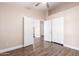 Empty bedroom with wood-look flooring, closet and doorway at 1538 W Wagner Dr, Gilbert, AZ 85233
