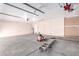 Empty two car garage with water heater and ladder at 1538 W Wagner Dr, Gilbert, AZ 85233