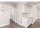 Hallway with white cabinets, countertops and doorway at 1538 W Wagner Dr, Gilbert, AZ 85233