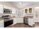 Bright kitchen featuring stainless steel appliances and shaker style cabinets at 1538 W Wagner Dr, Gilbert, AZ 85233