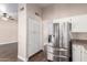 Bright kitchen with stainless steel refrigerator and a lot of storage space at 1538 W Wagner Dr, Gilbert, AZ 85233