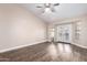 Open living room with hardwood floors and backyard access through French doors at 1538 W Wagner Dr, Gilbert, AZ 85233