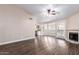 Open living area with fireplace, wood-look flooring, and lots of windows providing ample natural light at 1538 W Wagner Dr, Gilbert, AZ 85233