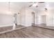 Large living room featuring wood-look floors and ample natural light, perfect for entertaining at 1538 W Wagner Dr, Gilbert, AZ 85233