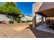 Expansive backyard with covered patio offers a great space for outdoor gatherings and relaxation at 18484 W Westfall Way, Surprise, AZ 85374