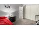 Well-lit bedroom with neutral carpet, a ceiling fan and convenient closet and bathroom access at 18484 W Westfall Way, Surprise, AZ 85374