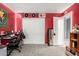Bedroom featuring a plush carpet, red walls, a ceiling fan and closet with sliding doors at 18484 W Westfall Way, Surprise, AZ 85374