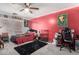 Lively bedroom with colorful accents, featuring a plush carpet and ceiling fan at 18484 W Westfall Way, Surprise, AZ 85374