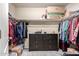Spacious walk-in closet with ample storage space and well-organized clothing racks at 18484 W Westfall Way, Surprise, AZ 85374