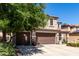Attractive home with a two-car garage and well-maintained front yard creating a pleasing facade at 18484 W Westfall Way, Surprise, AZ 85374
