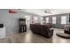 Living room with arcade game, neutral paint, ceiling fan and lots of Ohio State memorabilia at 18484 W Westfall Way, Surprise, AZ 85374