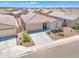 Aerial view of single-Gathering home featuring a spacious driveway and manicured landscaping at 18501 E Donato Dr, Gold Canyon, AZ 85118