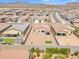 Home featuring a spacious backyard with desert landscaping, artificial turf, and block fencing at 18501 E Donato Dr, Gold Canyon, AZ 85118