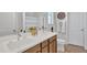 Bright bathroom featuring double sinks, a mirror, and white countertop at 18501 E Donato Dr, Gold Canyon, AZ 85118