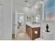 Bright bathroom featuring double sinks, a mirror, and wood look flooring at 18501 E Donato Dr, Gold Canyon, AZ 85118