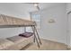 Bedroom with bunk beds, neutral walls, and a window for natural light at 18501 E Donato Dr, Gold Canyon, AZ 85118