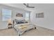 Bright bedroom featuring a ceiling fan, carpet flooring and a picture on the wall at 18501 E Donato Dr, Gold Canyon, AZ 85118