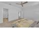 Bright primary bedroom featuring a ceiling fan, carpet flooring, and ensuite bathroom at 18501 E Donato Dr, Gold Canyon, AZ 85118