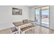 Bright dining area features a wood table and bench seating and sliding glass door to backyard at 18501 E Donato Dr, Gold Canyon, AZ 85118