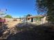 Expansive backyard showing the exterior, including a clothesline and gate access to the yard at 1907 W Gardenia Dr, Phoenix, AZ 85021