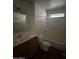Functional bathroom with a single sink vanity, toilet, and a shower-tub combination at 1907 W Gardenia Dr, Phoenix, AZ 85021
