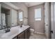 Bathroom featuring double sinks with sleek, black hardware, and tile flooring at 19690 W Marshall Ave, Litchfield Park, AZ 85340