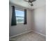 Cozy bedroom with tile floors, a ceiling fan, and a window with views at 19690 W Marshall Ave, Litchfield Park, AZ 85340