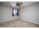 Neutral bedroom with soft carpet and ceiling fan fixture at 19690 W Marshall Ave, Litchfield Park, AZ 85340