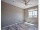 The bedroom features neutral walls and stylish wood flooring with lots of natural light at 19690 W Marshall Ave, Litchfield Park, AZ 85340