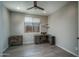 Bedroom features tile flooring, fan fixture and workstation at 19690 W Marshall Ave, Litchfield Park, AZ 85340