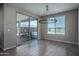 Bright dining area featuring a chandelier and sliding glass doors to the pool and patio at 19690 W Marshall Ave, Litchfield Park, AZ 85340
