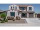 Charming two-story home featuring tile roof, stucco exterior, and manicured front yard at 19690 W Marshall Ave, Litchfield Park, AZ 85340