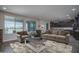 Spacious living room with view to the backyard and connection to the kitchen at 19690 W Marshall Ave, Litchfield Park, AZ 85340